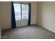 Bright bedroom with carpet and window coverings at 4051 W Buckskin Trl, Phoenix, AZ 85083
