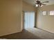 Primary bedroom with carpeted floors and ceiling fan at 4051 W Buckskin Trl, Phoenix, AZ 85083