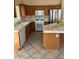 Kitchen featuring wood cabinets, tile countertops, and stainless steel appliances at 4051 W Buckskin Trl, Phoenix, AZ 85083
