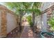 Brick pathway leads to private backyard oasis at 4238 N 44Th St, Phoenix, AZ 85018