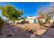 Landscaped backyard with gravel and mature trees at 4238 N 44Th St, Phoenix, AZ 85018