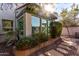 Sunlit exterior with stone pathway and lush plants at 4238 N 44Th St, Phoenix, AZ 85018