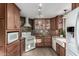 Modern kitchen featuring wood cabinets and white appliances at 4238 N 44Th St, Phoenix, AZ 85018