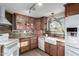 Updated kitchen with wood cabinets and a farmhouse sink at 4238 N 44Th St, Phoenix, AZ 85018