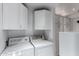 Laundry room with washer, dryer, and cabinets at 4238 N 44Th St, Phoenix, AZ 85018