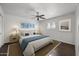 Comfortable bedroom with hardwood floors and plenty of natural light at 44824 N 10Th St, New River, AZ 85087