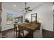 Charming dining room with hardwood floors and a view of the backyard at 44824 N 10Th St, New River, AZ 85087