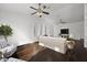 Bright living room with hardwood floors, a fireplace, and built-in shelving at 44824 N 10Th St, New River, AZ 85087