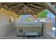 Covered outdoor hot tub area with stone flooring and built in cabinets at 957 E Cedar Dr, Chandler, AZ 85249