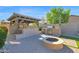 Outdoor kitchen includes a grill, oven, and fire pit, perfect for entertaining at 957 E Cedar Dr, Chandler, AZ 85249