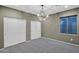 Bedroom featuring neutral paint, chandelier and closet with sliding doors at 957 E Cedar Dr, Chandler, AZ 85249