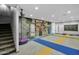 Spacious game room features colorful flooring and unique industrial decor at 957 E Cedar Dr, Chandler, AZ 85249