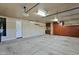 Spacious garage featuring a door to the main house and ample cabinet storage at 957 E Cedar Dr, Chandler, AZ 85249