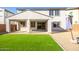 Covered patio and artificial turf backyard at 14271 W Alameda Rd, Surprise, AZ 85387
