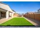 Spacious backyard with artificial turf and a trampoline at 14271 W Alameda Rd, Surprise, AZ 85387