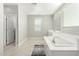 Spa-like bathroom with soaking tub and separate shower at 14271 W Alameda Rd, Surprise, AZ 85387