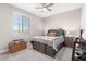 Spacious bedroom with large bed and window at 14271 W Alameda Rd, Surprise, AZ 85387