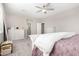 Spacious bedroom with carpeted floor, dresser, and ceiling fan at 14271 W Alameda Rd, Surprise, AZ 85387