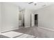 Bedroom with private bathroom access and neutral-toned carpeting at 14271 W Alameda Rd, Surprise, AZ 85387