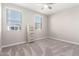 Bright bedroom featuring neutral walls, plush carpeting, and two large windows at 14271 W Alameda Rd, Surprise, AZ 85387
