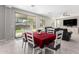 Casual dining area with red tablecloth and sliding door access to backyard at 14271 W Alameda Rd, Surprise, AZ 85387