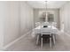 Dining room with white table and chairs, and a chandelier at 14271 W Alameda Rd, Surprise, AZ 85387
