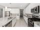 Kitchen with white cabinets, granite countertops, and stainless steel appliances at 14271 W Alameda Rd, Surprise, AZ 85387