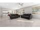 Living room with gray sofas and a large flat-screen TV at 14271 W Alameda Rd, Surprise, AZ 85387