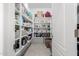Walk-in pantry with ample shelving for storage at 14271 W Alameda Rd, Surprise, AZ 85387