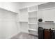 Bright walk-in closet with shelves and hanging rods at 14271 W Alameda Rd, Surprise, AZ 85387
