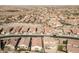 Aerial view of houses and streets in a community at 17849 W Thistle Landing Dr, Goodyear, AZ 85338
