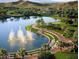 Lakefront park with walking paths and fountains at 17849 W Thistle Landing Dr, Goodyear, AZ 85338