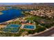 Tennis and basketball courts near a lake and community at 17849 W Thistle Landing Dr, Goodyear, AZ 85338