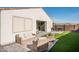 Landscaped backyard with patio furniture and putting green at 17849 W Thistle Landing Dr, Goodyear, AZ 85338