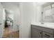 Bright bathroom with gray vanity and white countertop at 17849 W Thistle Landing Dr, Goodyear, AZ 85338