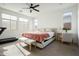Main bedroom with a queen-sized bed and en-suite bathroom at 17849 W Thistle Landing Dr, Goodyear, AZ 85338