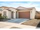 Modern house exterior with two-car garage at 17849 W Thistle Landing Dr, Goodyear, AZ 85338