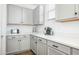 Kitchen with gray cabinets and quartz countertops at 17849 W Thistle Landing Dr, Goodyear, AZ 85338