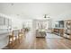 Open concept living area with hardwood floors, and a neutral color scheme at 17849 W Thistle Landing Dr, Goodyear, AZ 85338