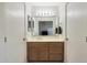 Clean bathroom with single sink vanity and shower/tub combo at 2042 E Aire Libre Ave, Phoenix, AZ 85022