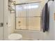 Bathroom featuring a shower/tub, toilet, and shelving at 2042 E Aire Libre Ave, Phoenix, AZ 85022