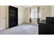 Bedroom with built-in shelving and window at 2042 E Aire Libre Ave, Phoenix, AZ 85022