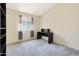 Bedroom with a desk and built-in shelving at 2042 E Aire Libre Ave, Phoenix, AZ 85022