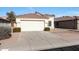 House exterior with a two-car garage and desert landscaping at 2042 E Aire Libre Ave, Phoenix, AZ 85022