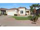 One-story house with a landscaped front yard and attached garage at 2042 E Aire Libre Ave, Phoenix, AZ 85022