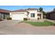 Single story home with front yard and attached garage at 2042 E Aire Libre Ave, Phoenix, AZ 85022