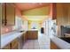 Kitchen featuring stainless steel appliances and wood cabinets at 2042 E Aire Libre Ave, Phoenix, AZ 85022
