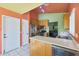 Open kitchen with stainless steel appliances and an island at 2042 E Aire Libre Ave, Phoenix, AZ 85022