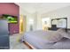 Main bedroom with TV, plenty of space, and a ceiling fan at 2042 E Aire Libre Ave, Phoenix, AZ 85022