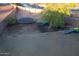 Large backyard with trampoline, playset, and mature tree at 25696 W Williams Ct, Buckeye, AZ 85326